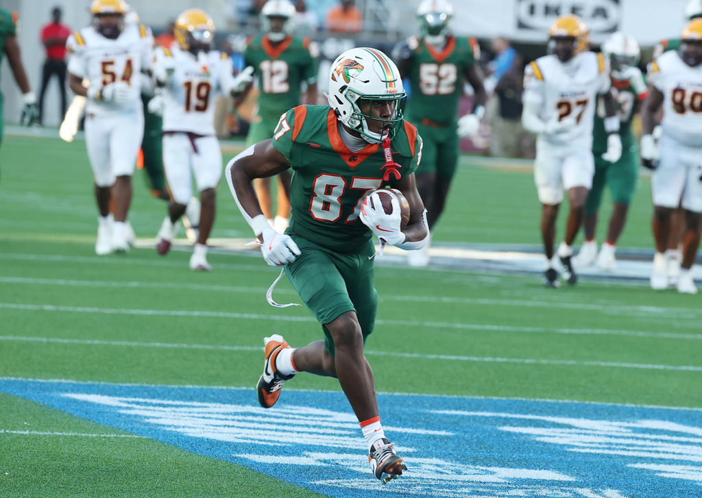 FAMU wide receiver Armand Burris (87) runs untouched into the endzone for a touchdown during an NCAA college football game of Bethune-Cookman versus Florida A&M, in Orlando on Saturday, Nov. 22, 2025. (Stephen M. Dowell/Orlando Sentinel via AP)