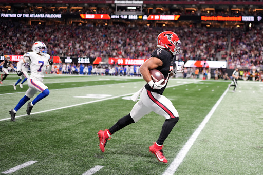 Atlanta Falcons running back Bijan Robinson (7) runs for a touchdown during the first half of an NFL football game against the Buffalo Bills, Monday, Oct. 13, 2025, in Atlanta. (AP Photo/Mike Stewart) Atlanta Falcons running back Bijan Robinson (7) runs for a touchdown during the first half of an NFL football game against the Buffalo Bills, Monday, Oct. 13, 2025, in Atlanta. (AP Photo/Mike Stewart)