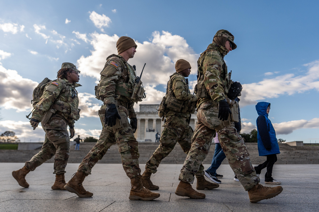 Members of the National Guard patrol in front of the Lincoln Memorial on the National Mall, Friday, Nov. 28, 2025, in Washington. (AP Photo/Julia Demaree Nikhinson)