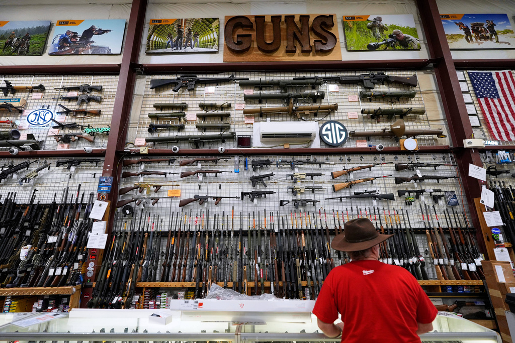 Guns are displayed at Maine Military Supply, Tuesday, Nov. 4, 2025, in Holden, Maine. (AP Photo/Robert F. Bukaty)