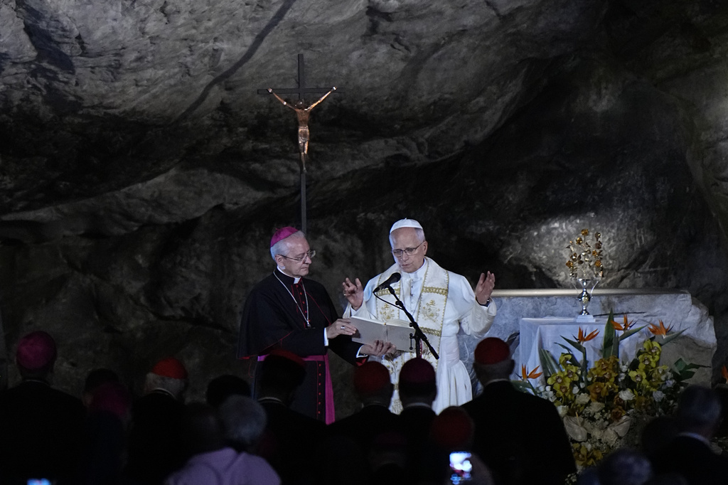 Pope Leo XIV prays at the Grotto of the Apparitions of Massabielle, in Lourdes, France, Saturday, Sept. 26, 2026. (AP Photo/Laurent Cipriani)