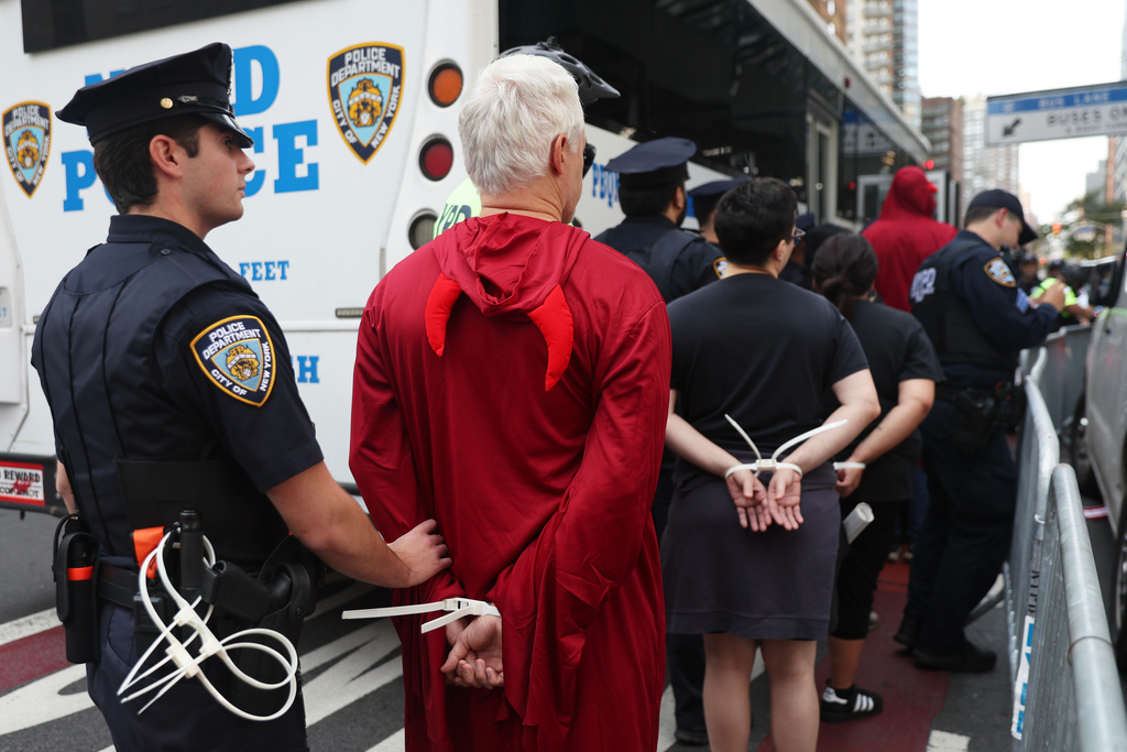 Protesters are arrested as they attempt to block traffic during the 80th session of the United Nations General Assembly, Tuesday, Sept. 23, 2025, in New York. (AP Photo/Heather Khalifa)