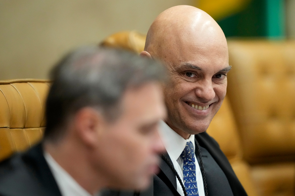 Supreme Court Justice Alexandre de Moraes smiles alongside Justice Andre Mendonca during a plenary session of the court in Brasilia, Brazil, Wednesday, Sept. 2, 2026. (AP Photo/Eraldo Peres)