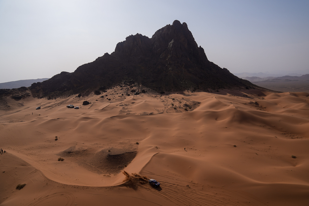 Driver Carlos Sainz and co-driver Lucas Cruz compete during the second stage of the Dakar Rally between Yanbu and Alula, Saudi Arabia, Monday, Jan. 5, 2026. (AP Photo/Thibault Camus)