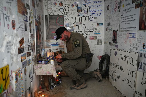An Israeli soldier lights candles in a roadside bomb shelter where people were killed during the deadly Oct. 7, 2023, Hamas attack near the Israel-Gaza border, as Israel marks the second anniversary of the attack, Tuesday, Oct. 7, 2025. (AP Photo/Ohad Zwigenberg) An Israeli soldier lights candles in a roadside bomb shelter where people were killed during the deadly Oct. 7, 2023, Hamas attack near the Israel-Gaza border, as Israel marks the second anniversary of the attack, Tuesday, Oct. 7, 2025. (AP Photo/Ohad Zwigenberg)