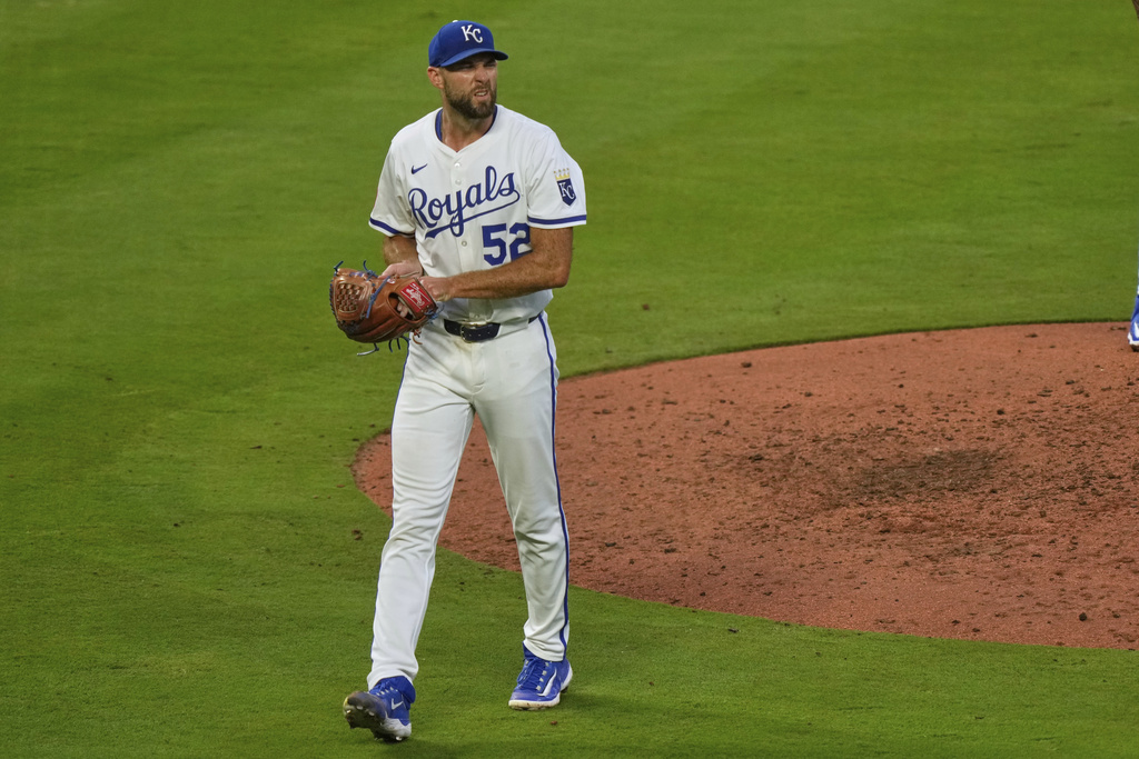 Kansas City Royals starting pitcher Michael Wacha walks to the dugout after coming out of the game during the sixth inning of a baseball game against the Washington Nationals, Tuesday, Aug. 12, 2025, in Kansas City, Mo. (AP Photo/Charlie Riedel)