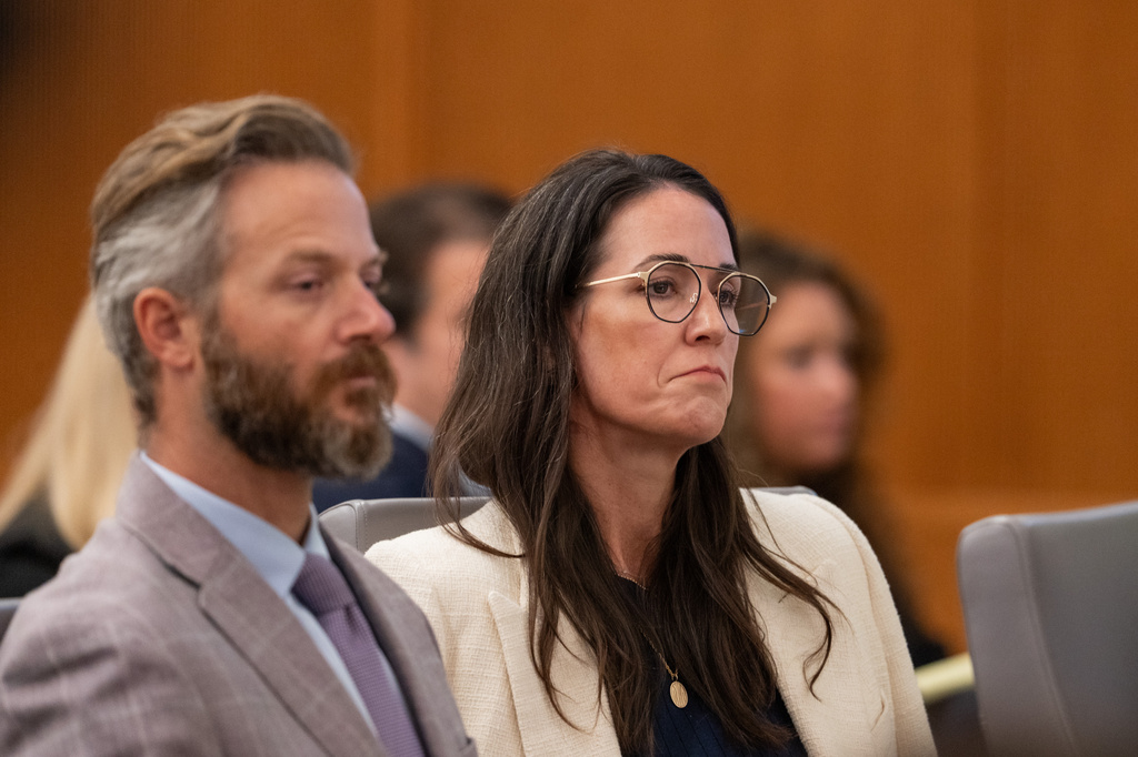 Will and CiCi Steward, who lost their 8-year-old daughter Cile Steward in the July 4 flood, listen to testimony from camp director Edward Eastland as they attend a hearing on a suit against Camp Mystic in the 459th State District Court in Austin, Tuesday, April 14, 2026. (Mikayla Compton/Austin American-Statesman via AP)