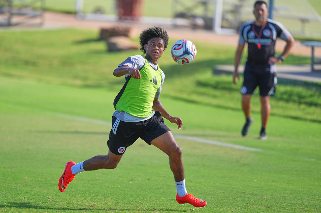 Benji Flowers plays in a scrimmage during a FC Dallas Academy soccer training session in Frisco, Texas, Friday, Aug. 14, 2026. (AP Photo/LM Otero)