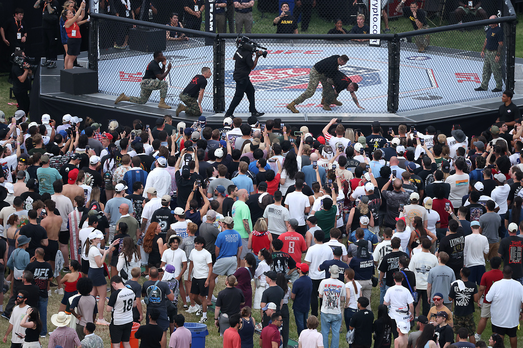 Army soldiers hold a grappling demonstration during the UFC Freedom 250 Fan Fest on The Ellipse ahead of the UFC Freedom 250 fight on the South Lawn of the White House on Sunday, June 14, 2026, in Washington. (Kevin Dietsch/Pool Photo via AP)