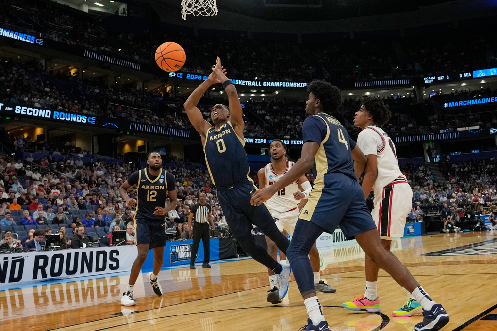 Akron forward Amani Lyles (0) loses control of the ball as he is fouled during the first half in the first round of the NCAA college basketball tournament against Texas Tech, Friday, March 20, 2026, in Tampa, Fla. (AP Photo/John Raoux)