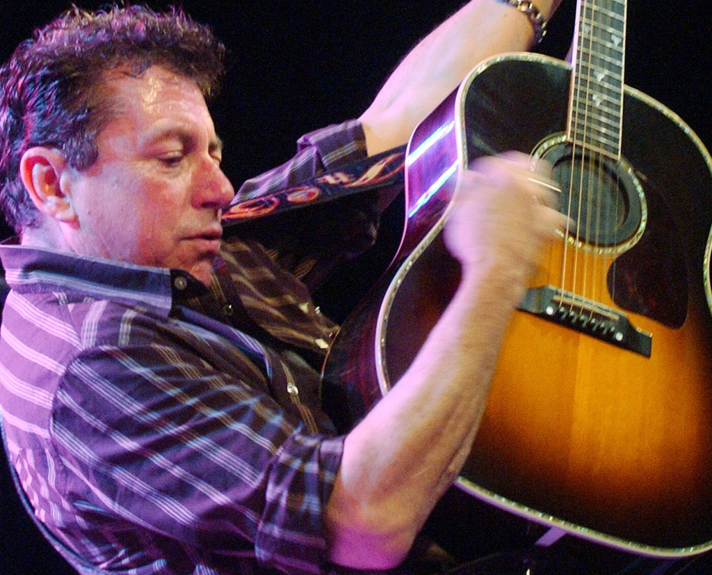 FILE - Joe Ely performs during the "Tsunami Relief — Austin to South Asia" concert at the Austin Music Hall in Austin, Texas Sunday, Jan. 9, 2005. (AP Photo/Kelly West, file)