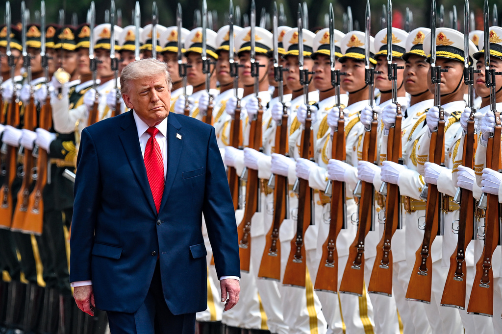 President Donald Trump reviews troops at the Great Hall of the People, Thursday, May 14, 2026, in Beijing. (Kenny Holston/The New York Times via AP, Pool)