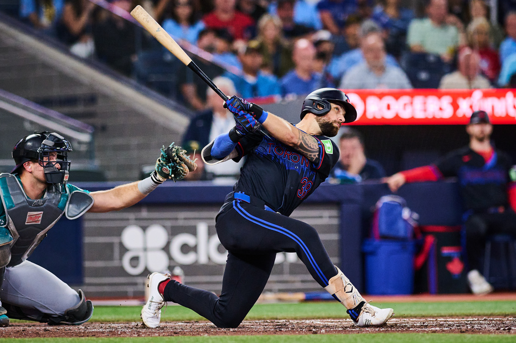 Toronto Blue Jays' Nathan Lukes, right, watches his solo home run against the Seattle Mariners during the fifth inning of a baseball game in Toronto, Friday, Aug. 28, 2026. (Sammy Kogan/The Canadian Press via AP)
