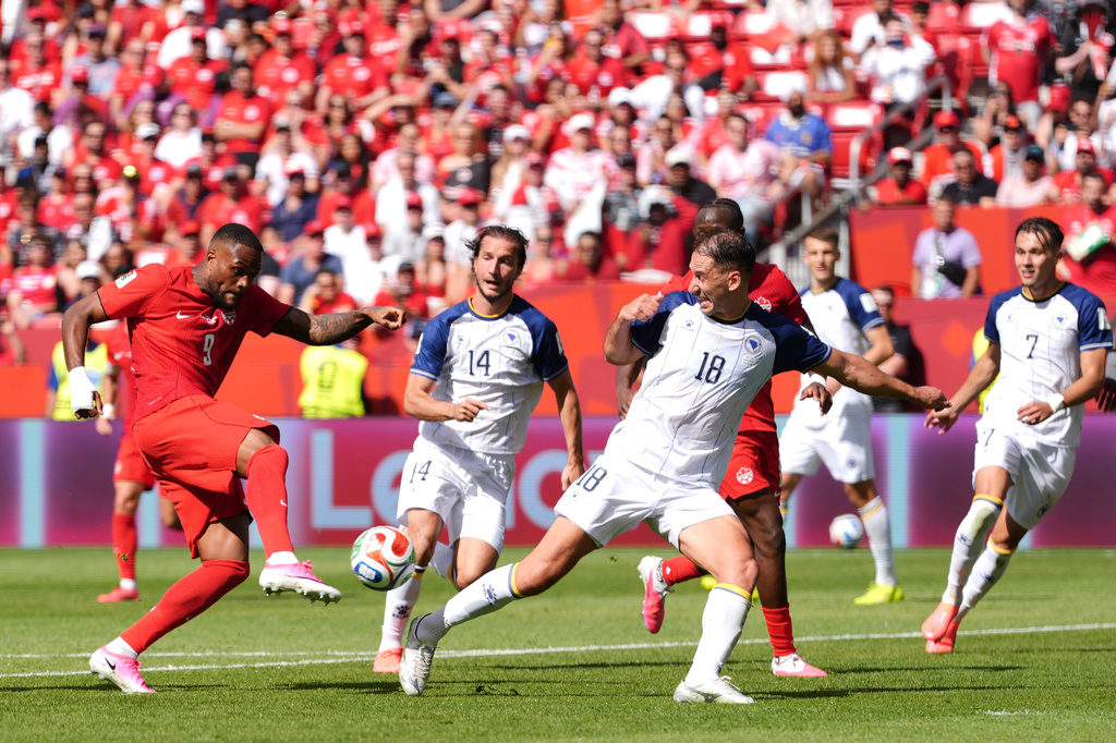 Canada's Cyle Larin (9) scores his sides first goal of the game in the second half of the World Cup Group B soccer match between Canada and Bosnia, Friday, June 12, 2026, in Toronto. (AP Photo/Sam Balkansky)