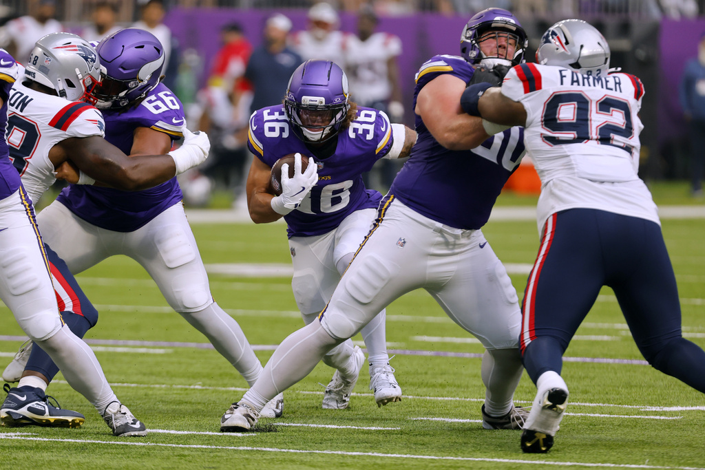 Minnesota Vikings running back Zavier Scott (36) runs with the ball during the first half of a preseason NFL football game against the New England Patriots Saturday, Aug. 16, 2025, in Minneapolis. (AP Photo/Bruce Kluckhohn)