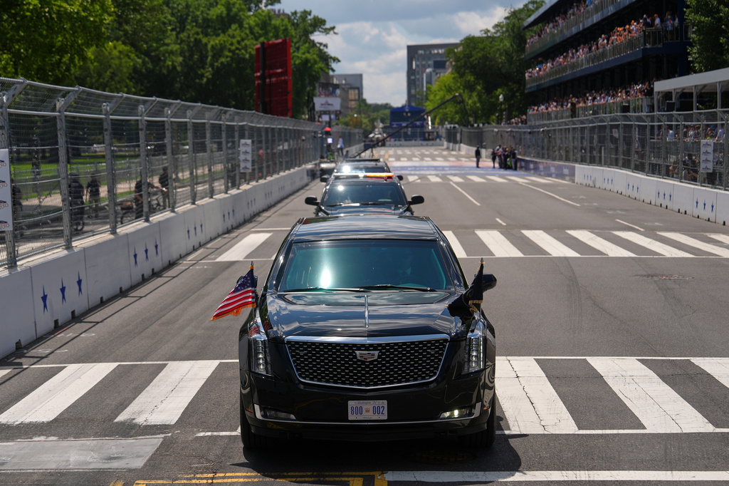 President Donald Trump, in the presidential limousine known as "The Beast," does a lap around the track before the IndyCar Freedom 250 Grand Prix auto race, Sunday, Aug. 23, 2026, in Washington. (AP Photo/Julia Demaree Nikhinson)