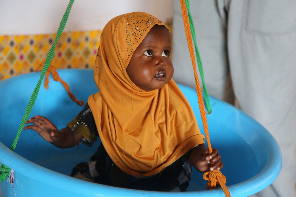 A child is weighed at Feynuus Nutrition Centre on the outskirts of the capital, Mogadishu, Somalia Wednesday, Aug. 19, 2026. (AP Photo/Farah Abdi Warsameh)