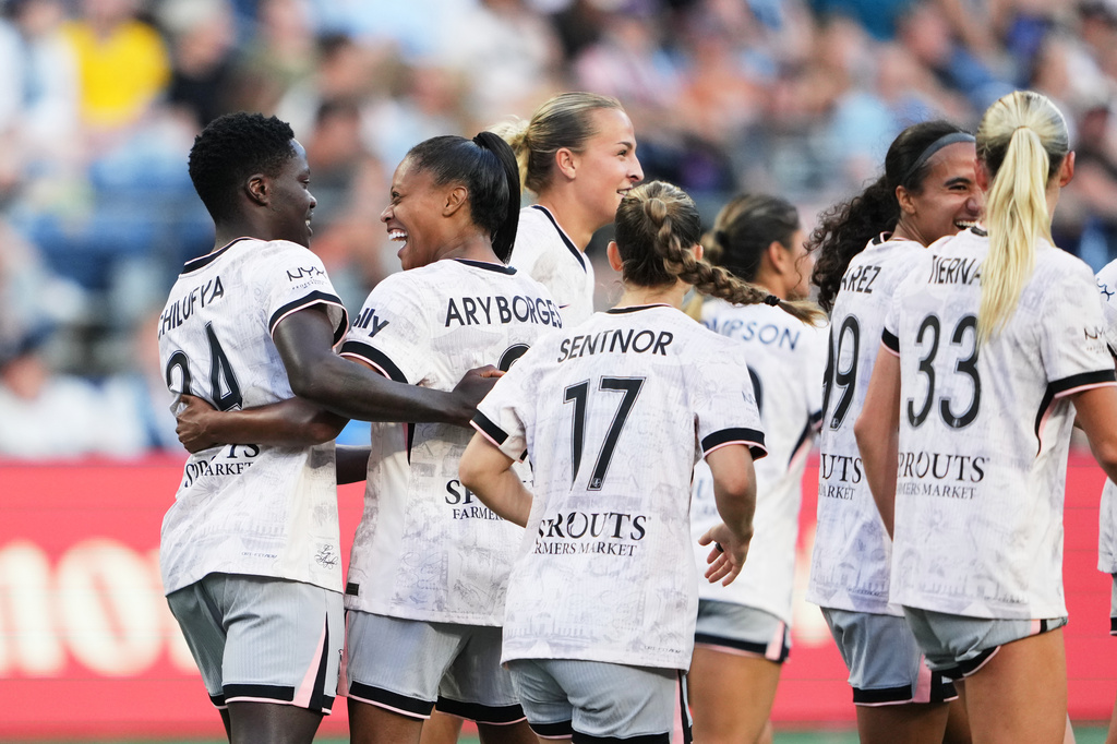 Angel City FC forward Prisca Chilufya, left, celebrates her goal with midfielder Ary Borges, second from left, against Seattle Reign FC during the second half of an NWSL soccer match, Sunday, Aug. 9, 2026, in Seattle. (AP Photo/Lindsey Wasson)