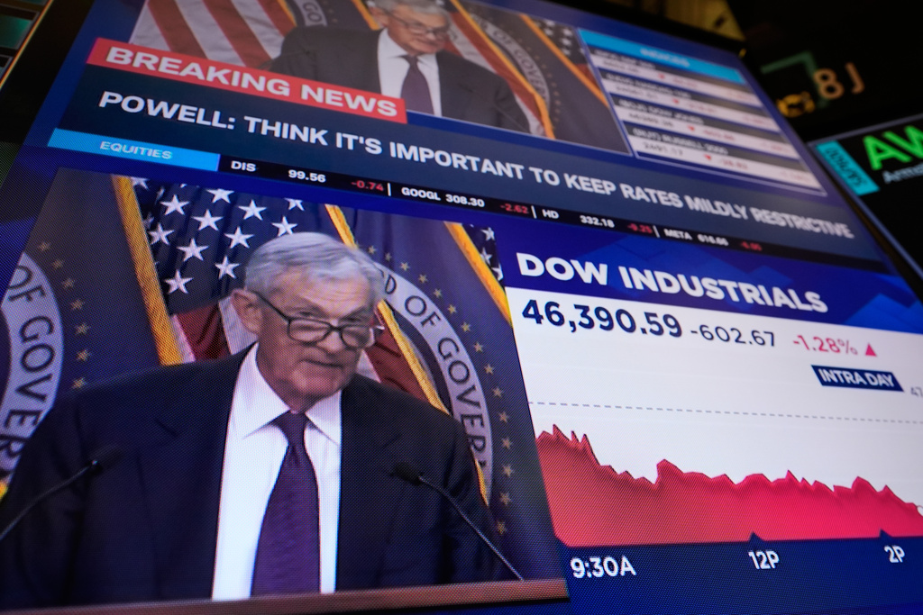 Television screens carry a news conference by Federal Reserve chair Jerome Powell on the floor of the New York Stock Exchange in New York, Wednesday, March 18, 2026. (AP Photo/Seth Wenig)