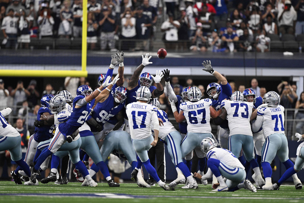 Dallas Cowboys place kicker Brandon Aubrey (17) kicks a game-winning field goal against the New York Giants in overtime of an NFL football game Sunday, Sept. 14, 2025, in Arlington, Texas. (AP Photo/Jerome Miron)