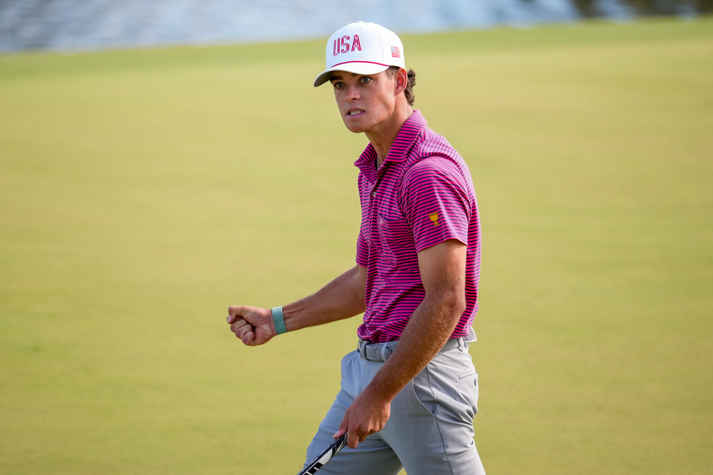 USA teams' Jackson Koivun reacts to his birdie putt on the 12th hole against the International team during a Presidents Cup golf tournament final round singles match at Medinah Country Club, Sunday, Sept. 27, 2026, in Medinah, Ill. (AP Photo/Matt Slocum)