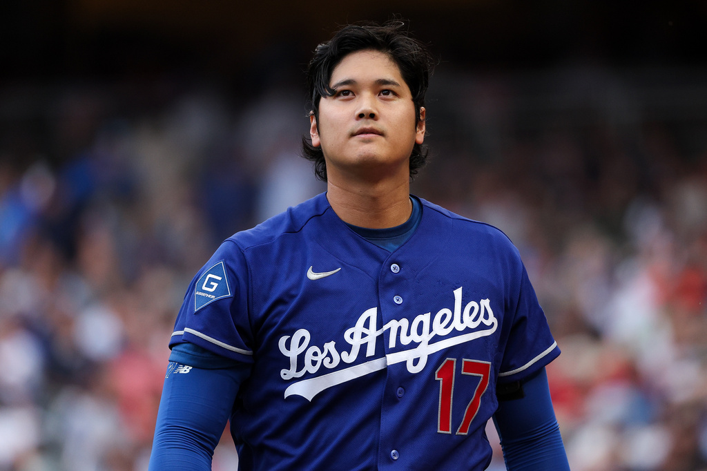 Los Angeles Dodgers designated hitter Shohei Ohtani looks on at the end of the first inning of a baseball game against the Minnesota Twins, Wednesday, June 24, 2026, in Minneapolis. (AP Photo/Matt Krohn)