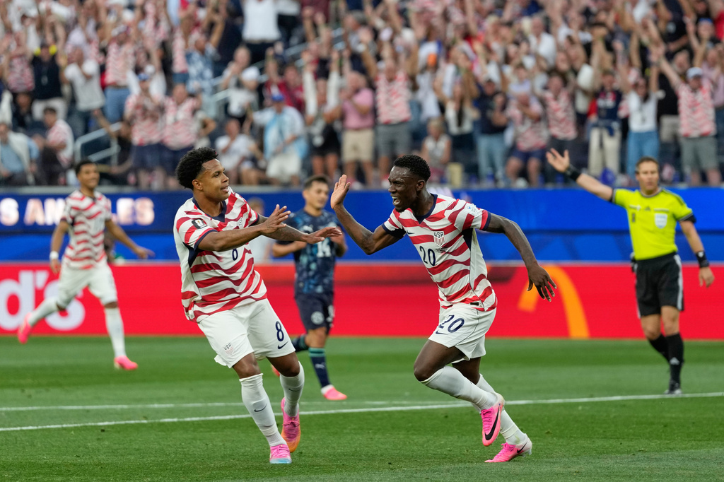 United States' Folarin Balogun (20) celebrates scoring his side's second goal against Paraguay during the World Cup Group D soccer match in Inglewood, Calif., near Los Angeles, Friday, June 12, 2026. (AP Photo/Andre Penner)
