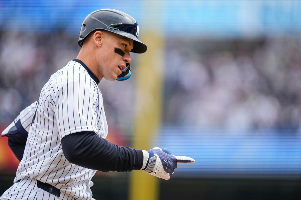 New York Yankees' Aaron Judge (99) celebrates after hitting a two-run home run during the first inning of the Yankees' home-opener baseball game against the Miami Marlins, Friday, April 3, 2026, in New York. (AP Photo/Yuki Iwamura)