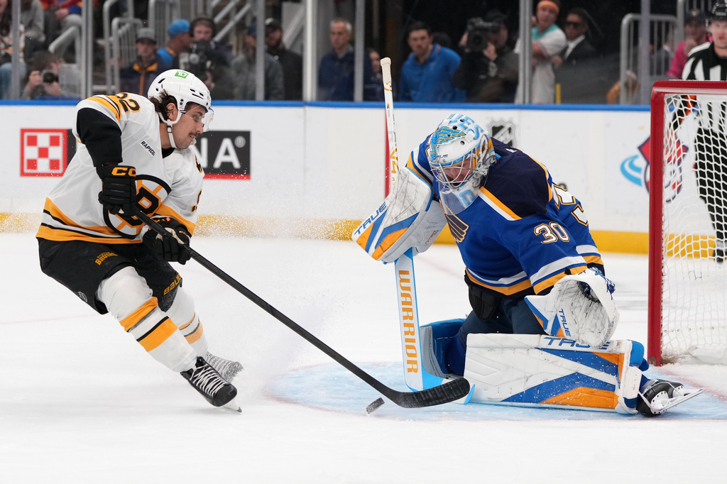 Boston Bruins' Marat Khusnutdinov (92) is unable to score past St. Louis Blues goaltender Joel Hofer (30) during the first period of an NHL hockey game Thursday, Oct. 29, 2026, in St. Louis. (AP Photo/Jeff Roberson)