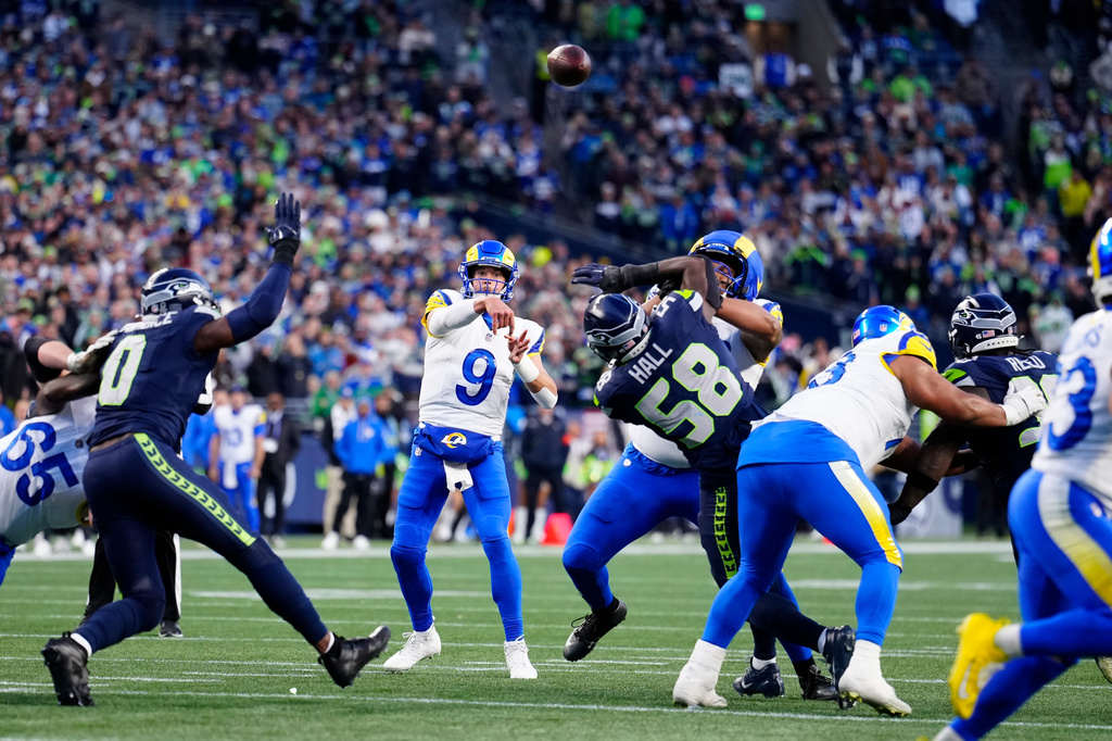 FILE - Los Angeles Rams quarterback Matthew Stafford (9) passes the ball during the NFC Championship NFL football game, Jan. 25, 2026, in Seattle. (AP Photo/Ben VanHouten, File)