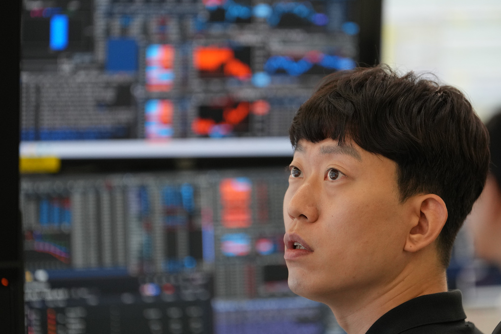 A dealer watches computer monitors at a dealing room of Hana Bank in Seoul, South Korea, Thursday, June 4, 2026. (AP Photo/Lee Jin-man)