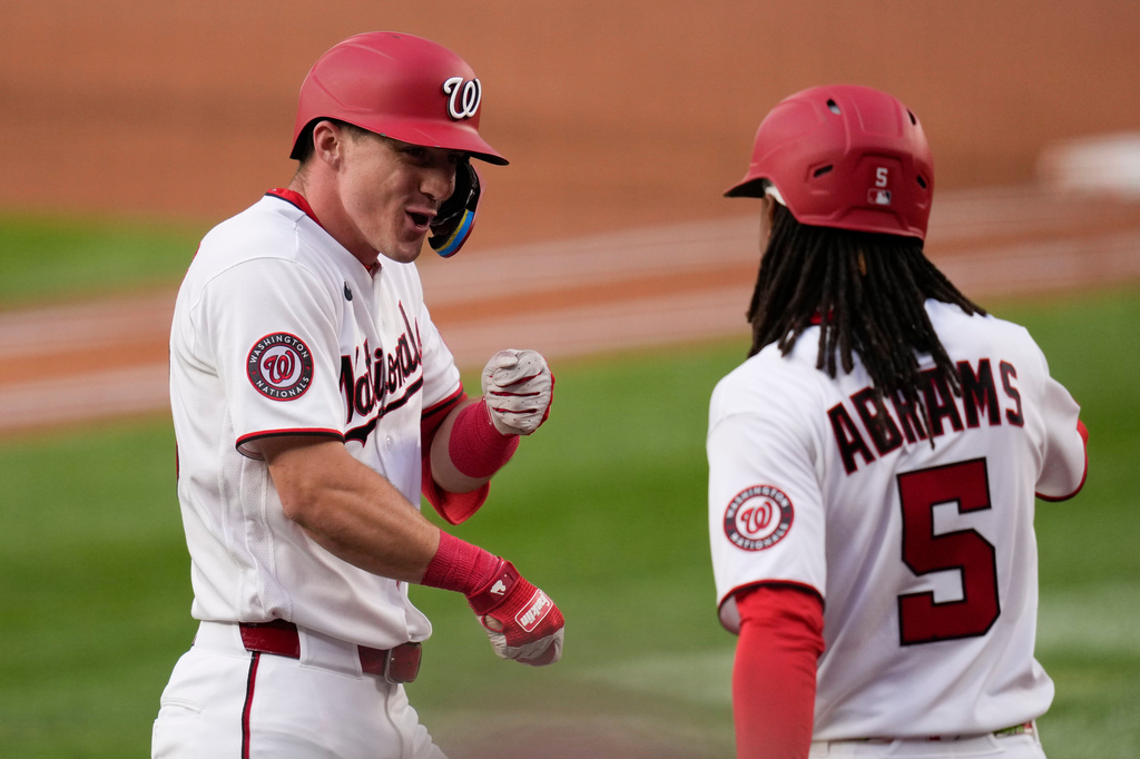 Washington Nationals' Jacob Young, left, celebrates after his home run against the Miami Marlins with CJ Abrams (5) during the second inning of a baseball game, Monday, June 1, 2026, in Washington. (AP Photo/Jess Rapfogel)