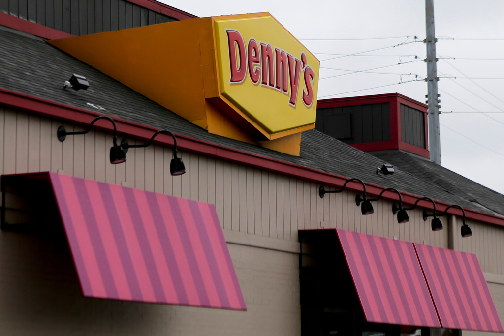 FILE - A large sign marks a Denny's restaurant Sept. 14, 2017, in Cranberry, Pa. (AP Photo/Keith Srakocic, File)