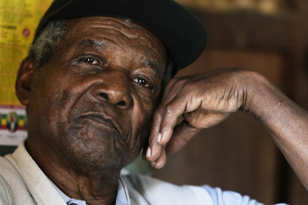 Julio Pinedo, a symbolic leader regarded as the king of the Afro-Bolivians, pauses during an interview at his home in Mururata, Bolivia, Sunday, Aug. 3, 2025. (AP Photo/Juan Karita)
