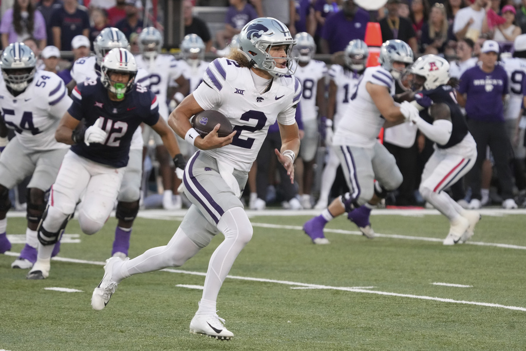 Kansas State quarterback Avery Johnson (2) runs the ball against Arizona in the first half of an NCAA college football game, Friday, Sept 12, 2025, in Tucson, Ariz. (AP Photo/Rick Scuteri)