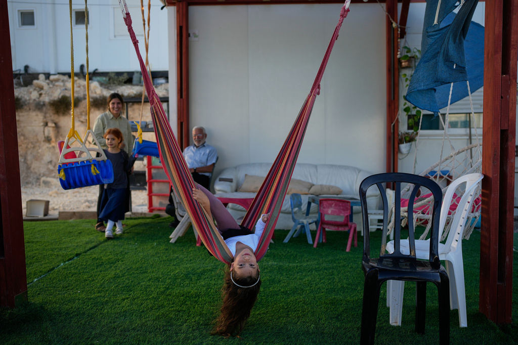Israeli settlers gather to celebrate the inauguration of a newly built synagogue at the occupied West Bank outpost of Homesh, Wednesday, Sept. 16, 2026. (AP Photo/Ohad Zwigenberg)