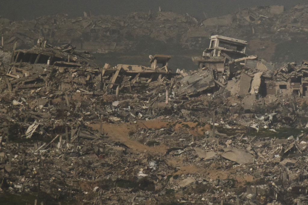 Buildings that were destroyed during the Israeli ground and air operations stand in the northern Gaza Strip as seen from southern Israel, Monday, Feb. 2, 2026. (AP Photo/Leo Correa)