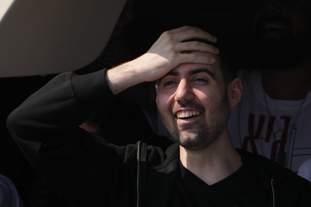 FILE - Freed Israeli hostage Guy Gilboa-Dalal gestures from a van as he arrives at Beilinson hospital in Petah Tikva, Israel, after he was released from Hamas captivity in the Gaza Stripl, Monday, Oct. 13, 2025. (AP Photo/Ariel Schalit, File)