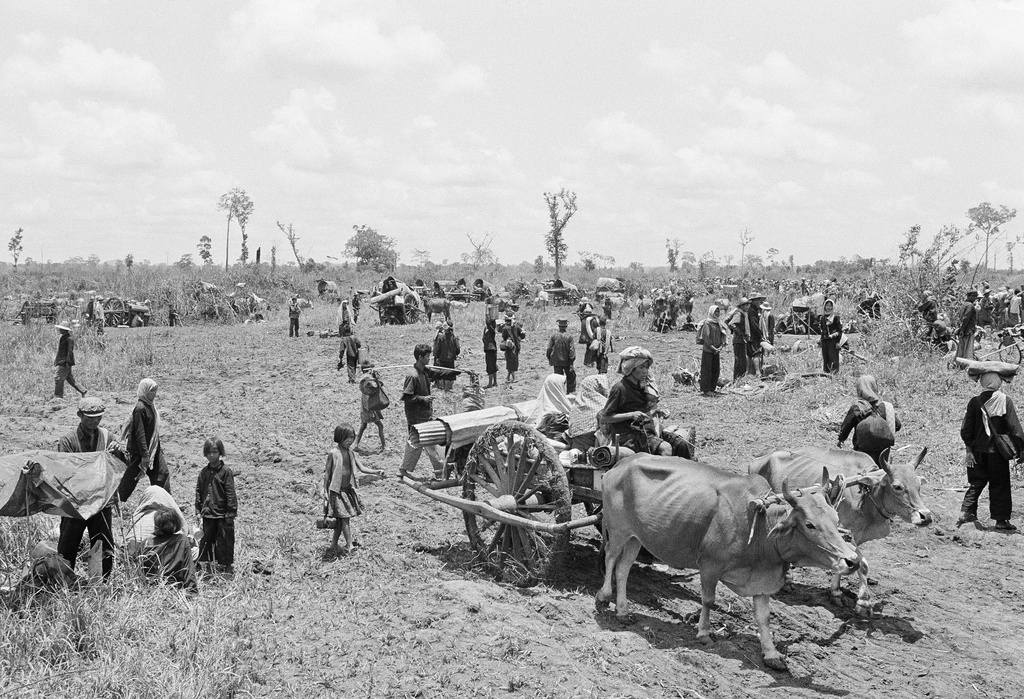 FILE - Fleeing Cambodians encamp on a scorching hot Thai farm field at Kud Pai Village near the countries' common border on April 27, 1979 in Thailand. Tens of thousands of Khmers, many of them soldiers loyal to be the government of ousted Premier Pol Pot, fled into Thailand recently to escape advancing Vietnamese forces. They were later forced to return to Cambodia. (AP Photo, File)