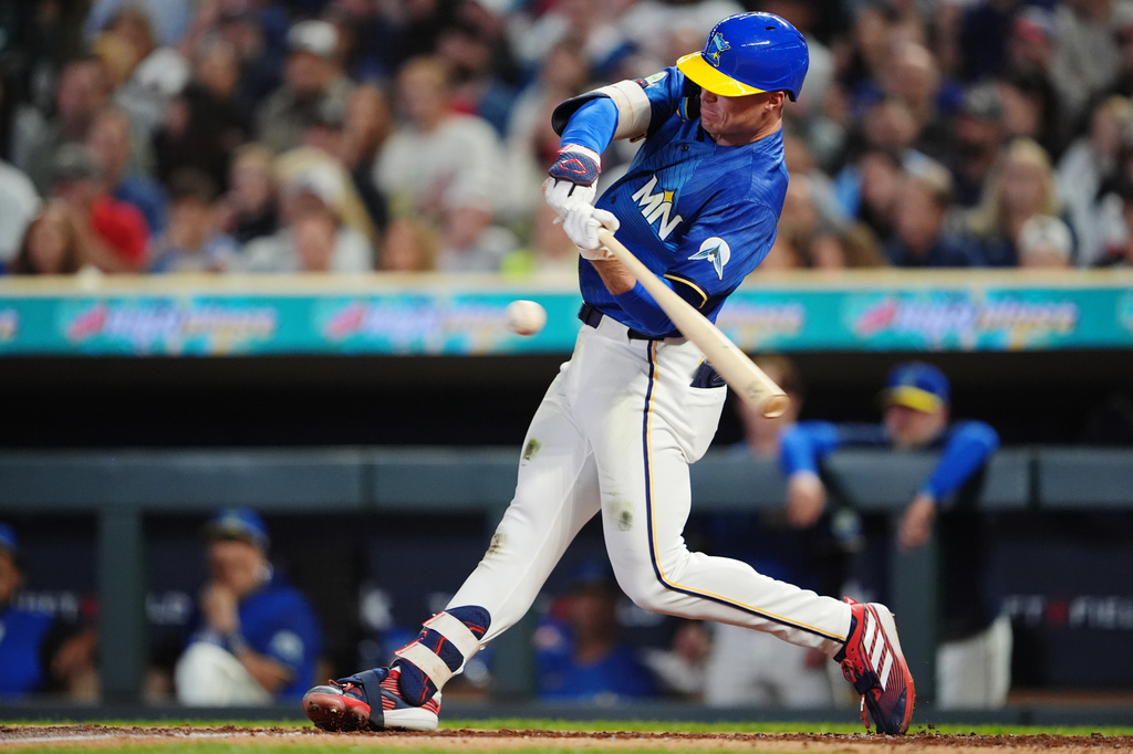 Minnesota Twins' Walker Jenkins hits a single during the second inning of a baseball game against the Texas Rangers, Friday, Sept. 25, 2026, in Minneapolis. (AP Photo/Ellen Schmidt)