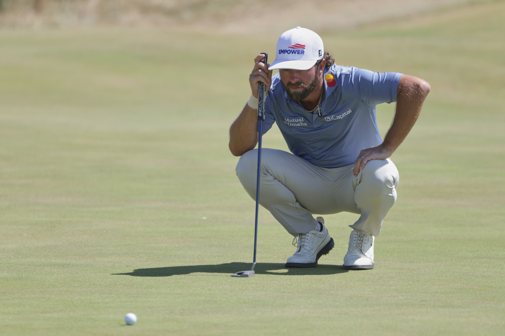 Cameron Young of the United States lines up his putt on the 7th green during the final day of the British Open Golf championships at Royal Birkdale golf club, in Southport, England, Sunday, July 19, 2026. (AP Photo/Peter Morrison)