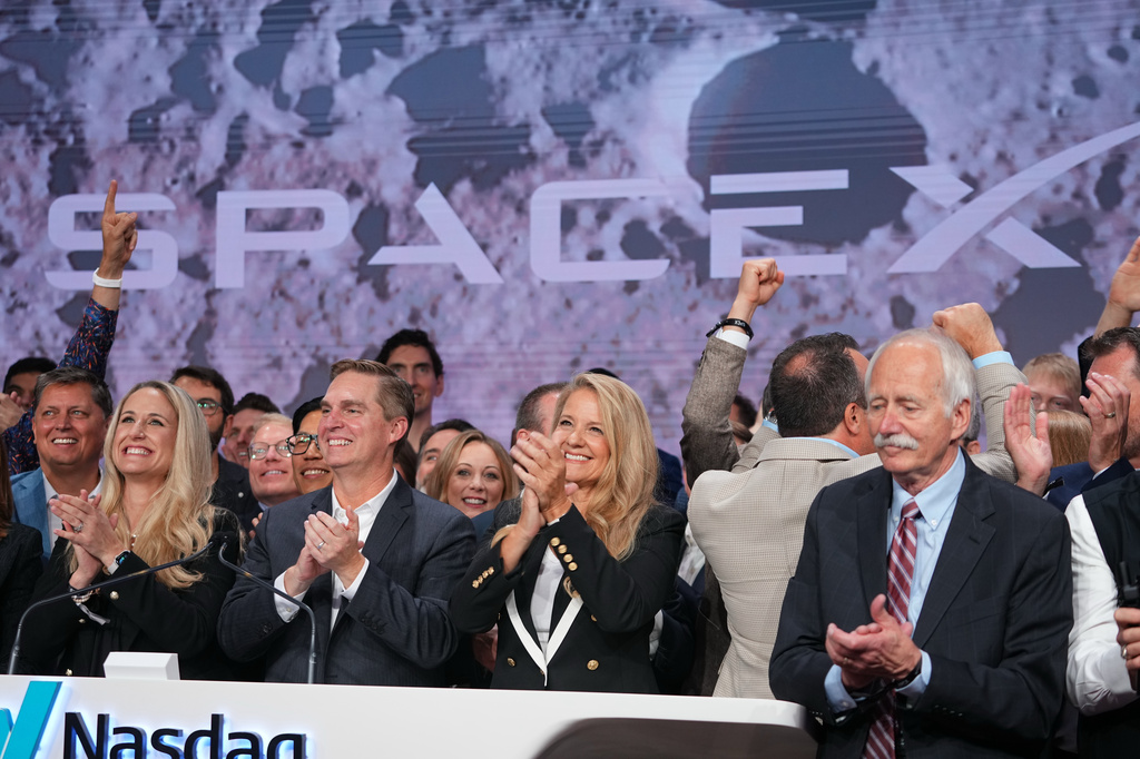 Gwynne Shotwell, President and COO of SpaceX celebrates with colleagues during a bell ringing ceremony for the IPO of SpaceX at the Nasdaq MarketSite in New York, Friday, June 12, 2026, in New York. (AP Photo/Frank Franklin II)