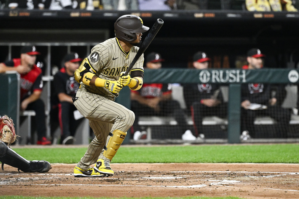 San Diego Padres' Luis Arraez hits an RBI single during the third inning of a baseball game against the Chicago White Sox, Friday, Sept. 19, 2025, in Chicago. (AP Photo/Matt Marton)