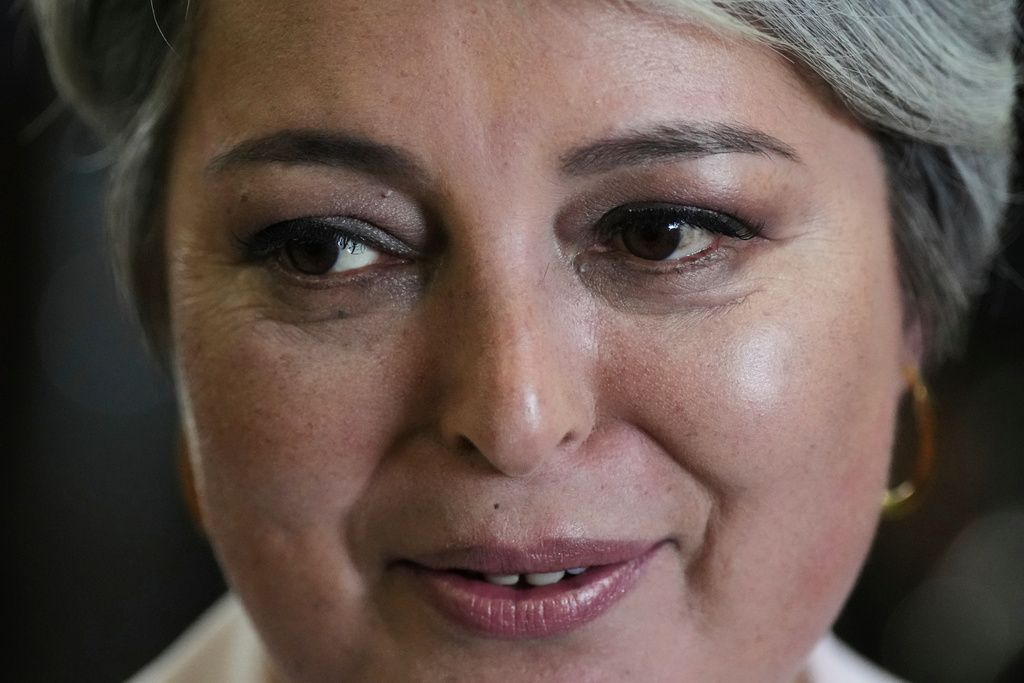Presidential candidate Jeannette Jara of the Unidad por Chile coalition arrives to vote during general elections in Santiago, Chile, Sunday, Nov. 16, 2025. (AP Photo/Natacha Pisarenko)