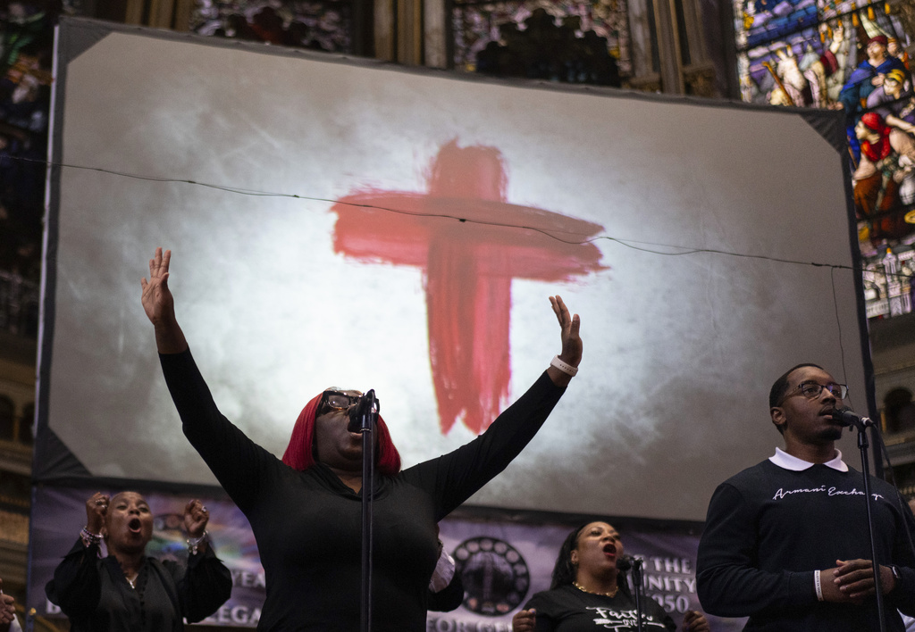 The New Mount Pilgrim Missionary Baptist Church choir, including Jennifer Hatch with arms raised, sings during a service Sunday, Sept. 7, 2025, in Chicago. (AP Photo/Carolyn Kaster)