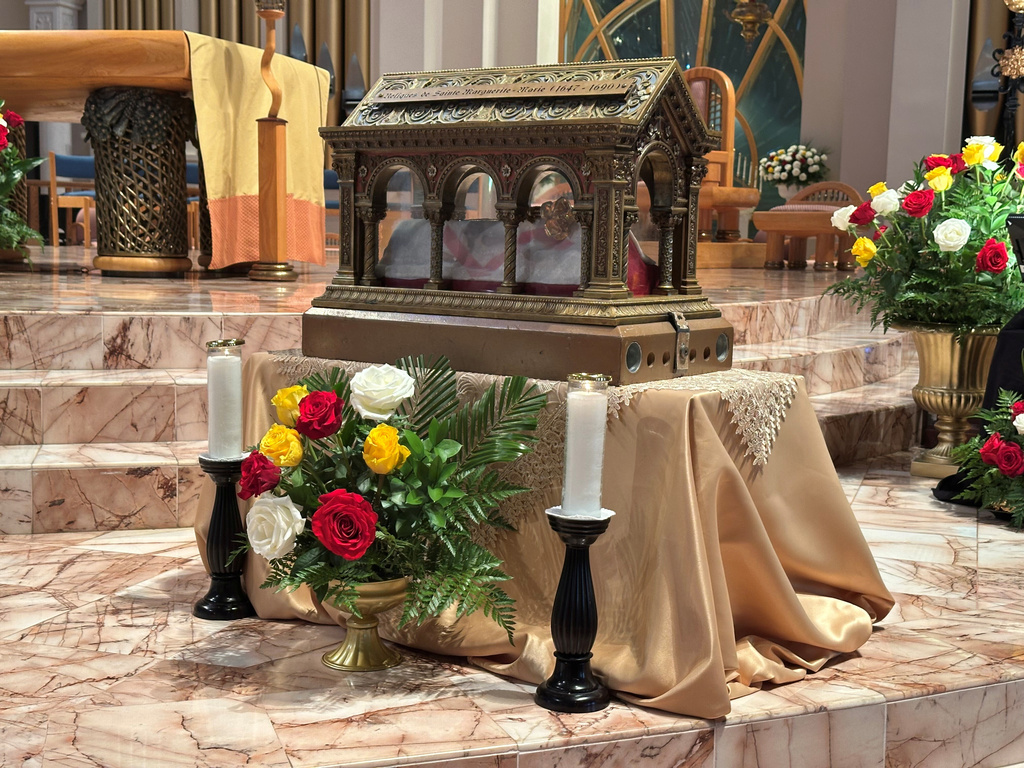 A box containing relics of the 17th century St. Mary Margaret Alacoque, a French nun whose reports of visions of Jesus has led to the modern devotion of the Sacred Heart of Jesus, stands Thursday in front of the Basilica of the National Shrine of Mary, Queen of the Universe in Orlando, Fla., before a service in which U.S. Catholic bishops consecrated the United States to the Sacred Heart upon the nation's 250th anniversary. (AP Photo/Peter Smith)