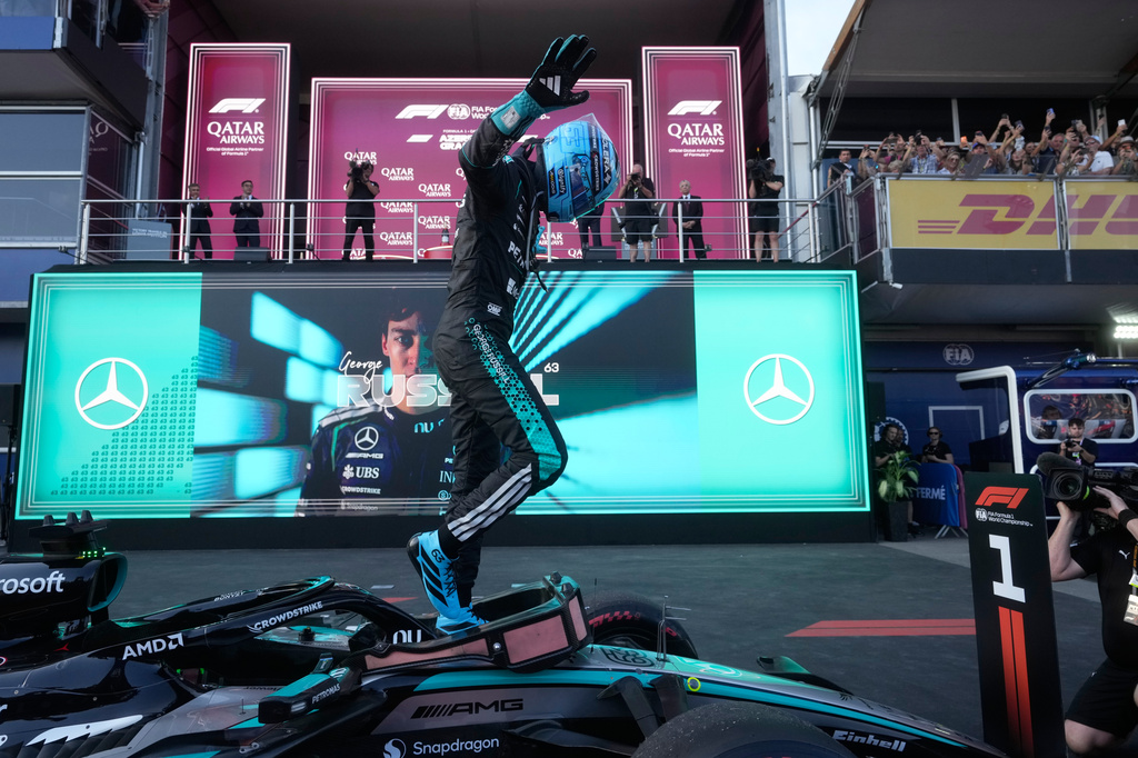 Mercedes driver George Russell of Britain celebrates after winning the Azerbaijan F1 Grand Prix auto race, in Baku, Azerbaijan, Saturday, Sept. 26, 2026. (AP Photo/Pavel Bednyakov)