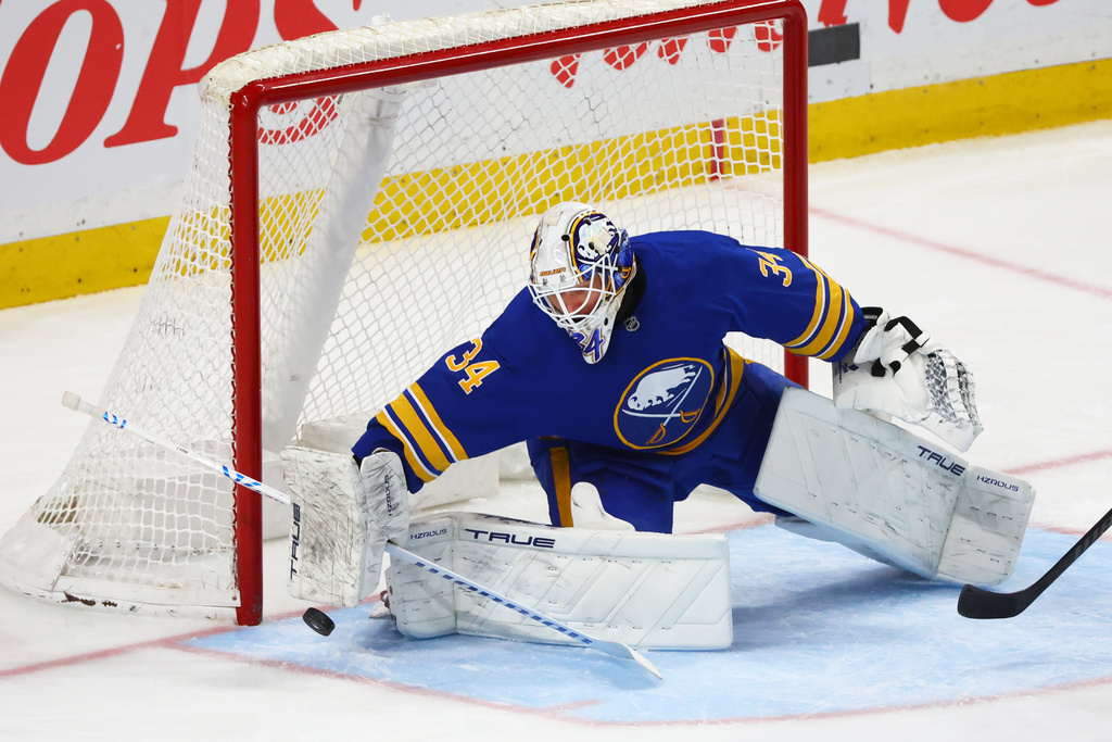 Buffalo Sabres goaltender Alex Lyon (34) makes a blocker save during the third period of an NHL hockey game against the Nashville Predators Saturday, March 7, 2026, in Buffalo, N.Y. (AP Photo/Jeffrey T. Barnes)