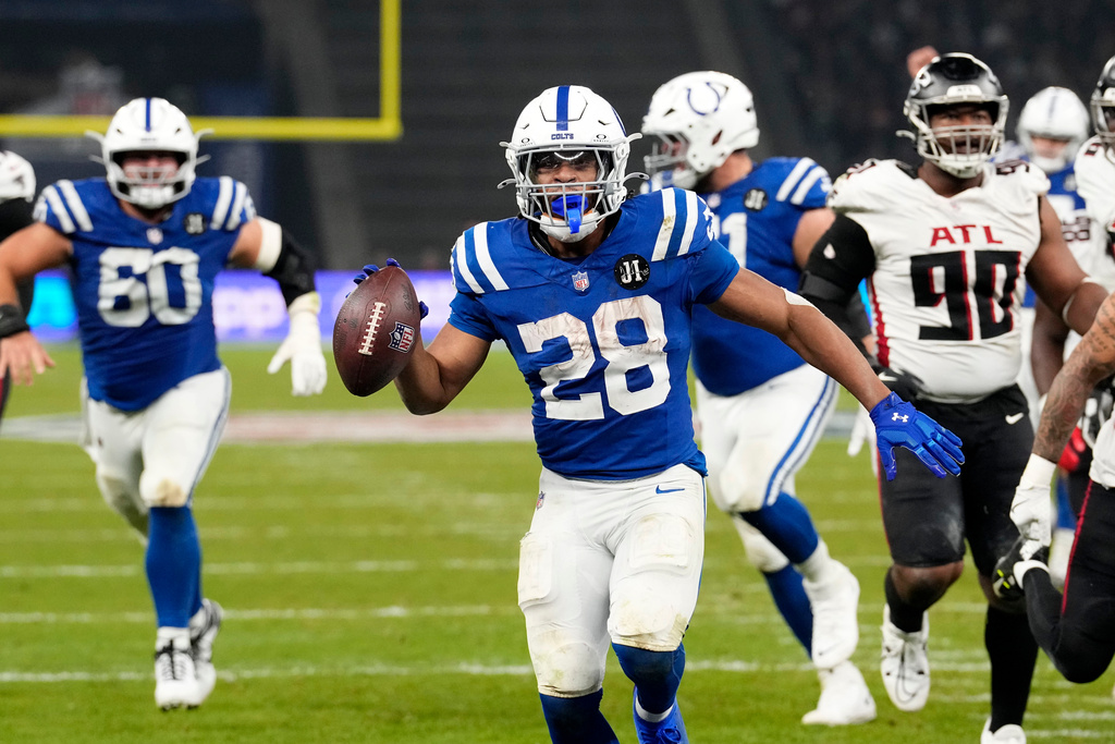 Indianapolis Colts running back Jonathan Taylor (28) scores a touchdown during overtime in an NFL football game against the Atlanta Falcons, Sunday, Nov. 9, 2025, in Berlin, Germany. (AP Photo/Martin Meissner)