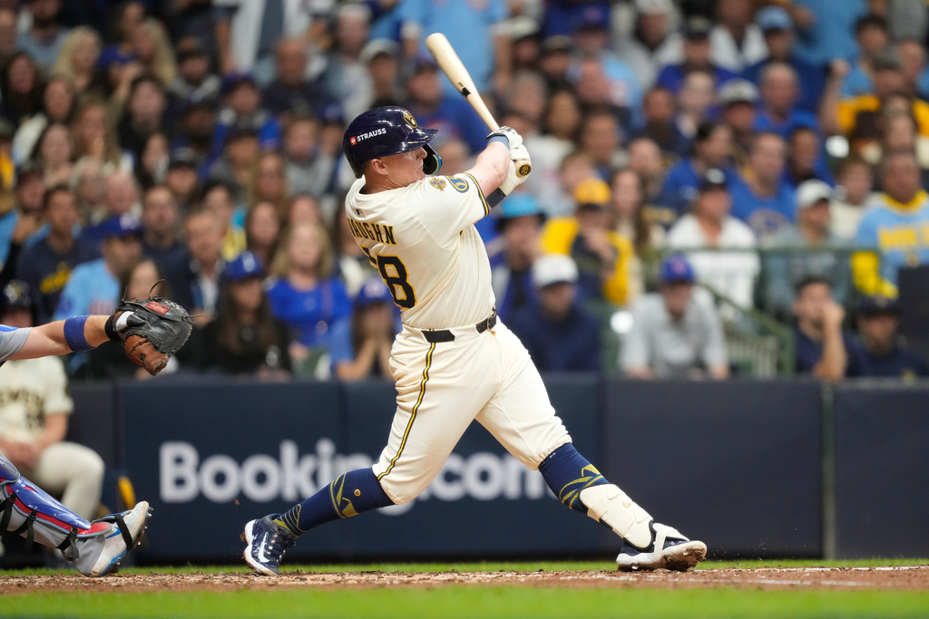Milwaukee Brewers first baseman Andrew Vaughn (28) hits a solo home run against the Chicago Cubs during the fourth inning of Game 5 of baseball's National League Division Series, Saturday, Oct. 11, 2025, in Milwaukee. (AP Photo/Kayla Wolf)
